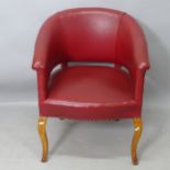 A 20th century style oak and red studded leather upholstered tub chair