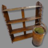 An Antique mahogany hanging shelf, 78 x 94 x 20cm, and a leather bucket, H68cm