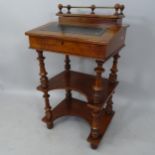 An early 20th century Davenport style writing desk, with raised back, lifting top and 2 shelves