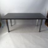 A Pieff dining table, the black top on black and chrome steel legs, 180 x 74 x 90cm