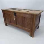 A 19th century panelled oak coffer, 123cm x 60cm x 54cm, with key