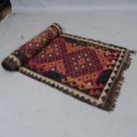 A Kilim runner, 357 x 73cm Rug has several holes to it mainly on the border and signs of wear,