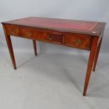 A reproduction mahogany writing desk, with red leather skiver and 3 frieze drawers, 122 x 75 x 61cm