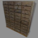 A Vintage stained pine bank of 40 drawers, 122 x 135 x 38cm