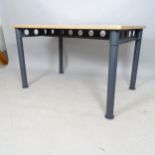 A contemporary industrial style table or desk, with steel base with circular cut-outs, 121cm x