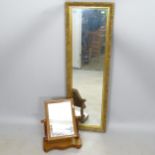A modern rectangular gilt-framed wall mirror, 38cm x 119cm, and a mahogany swing toilet mirror (2)