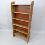 An early 20th century oak open bookcase, having 6 fixed shelves, 65cm x 130cm x 21cm