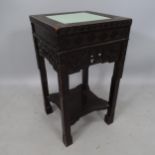 A 19th century Chinese side table, with carved decoration and inset celadon tile, 36 x 66cm
