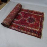 A red ground Persian Azerbajjan design runner with symmetrical decoration, 445 x 110cm Generally