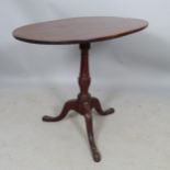 A mahogany turned wood standard lamp, on platform base, height to bayonet fitting 163cm