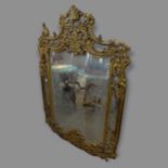 An ornate giltwood wall mirror, 105cm x 150cm