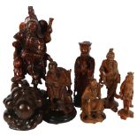 A quantity of Oriental figurines, depicting various fishermen and sages, largest height 38cm (7)