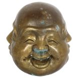 A 20th century Japanese bronze paperweight, showing 4 faces of Buddha, with seal mark to the base,