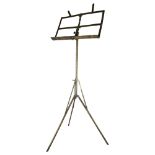 An early 20th century patented brass music stand, impressed markings Harrow & Co, height 112cm