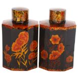 A pair of Oriental black lacquered caddies with lids, with floral decoration, height 16cm