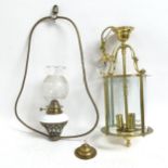 A brass-framed circular lantern with 3 bayonet fittings, length 73cm, and a hanging oil lamp with