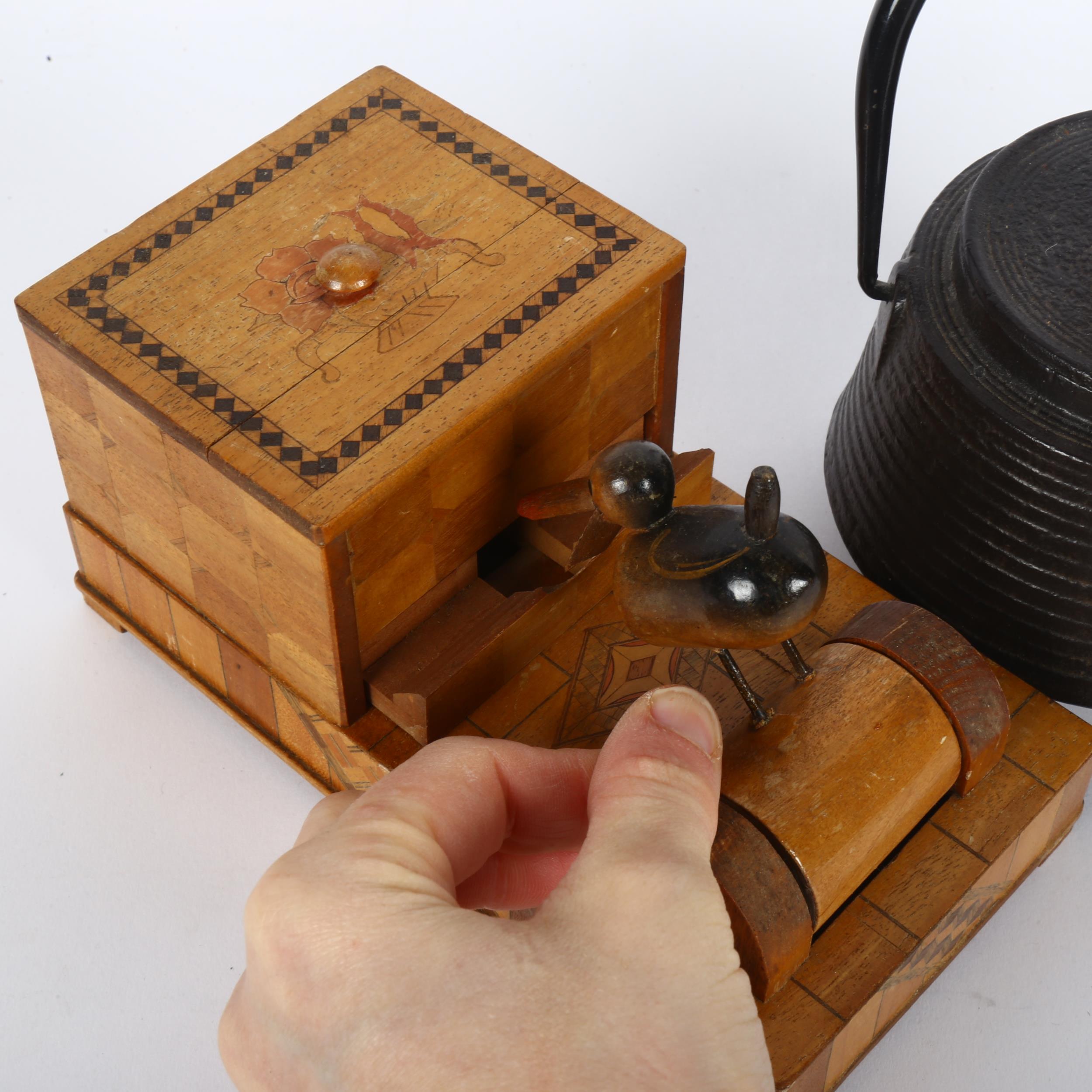 An early signed Japanese iron tea ceremonial teapot, plus a circa 1930s articulated wooden cigarette - Bild 2 aus 2