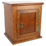 An early 20th century oak smoker's cabinet, H35cm, L32cm, W26cm