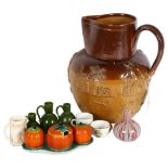 A large Antique stoneware salt glaze Harvest jug, a group of miniature graduated Rye Pottery