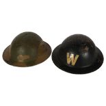 A World War II air raid warden's helmet with original insert and strap, and a Brodie helmet, with