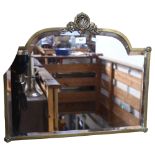An Antique brass-framed bevel-edge mirror with shell motif, 57cm across