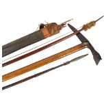 A group lot containing a quiver of iron-head arrows, an African spear with barbed head, a bow, and
