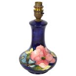 MOORCROFT - a tube-lined Hibiscus decorated table lamp, height to top of bayonet fitting 25cm Lamp