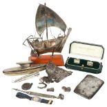 A group of silver and other items, including a 925 silver yacht, silver-handled nail buffer,