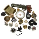 A group of Vintage military and other compasses, including the Magnapole, and a 1942 brass