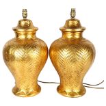 A pair of large modern gilded ceramic table lamps, height 50cm