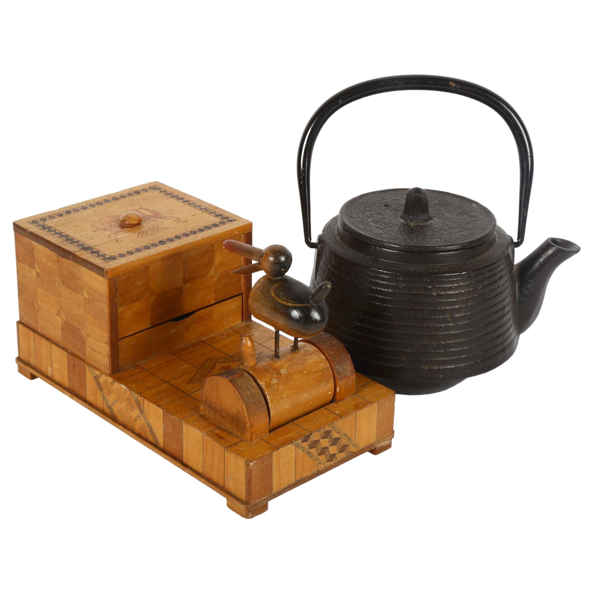 An early signed Japanese iron tea ceremonial teapot, plus a circa 1930s articulated wooden cigarette