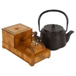 An early signed Japanese iron tea ceremonial teapot, plus a circa 1930s articulated wooden cigarette