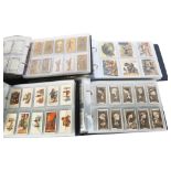 4 albums of WD & HO Wills Steven Mitchell & Son John Player & Sons cigarette cards, including