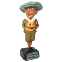 A painted composite golfing advertising figure "He Played A Penfold", height 52cm Good overall