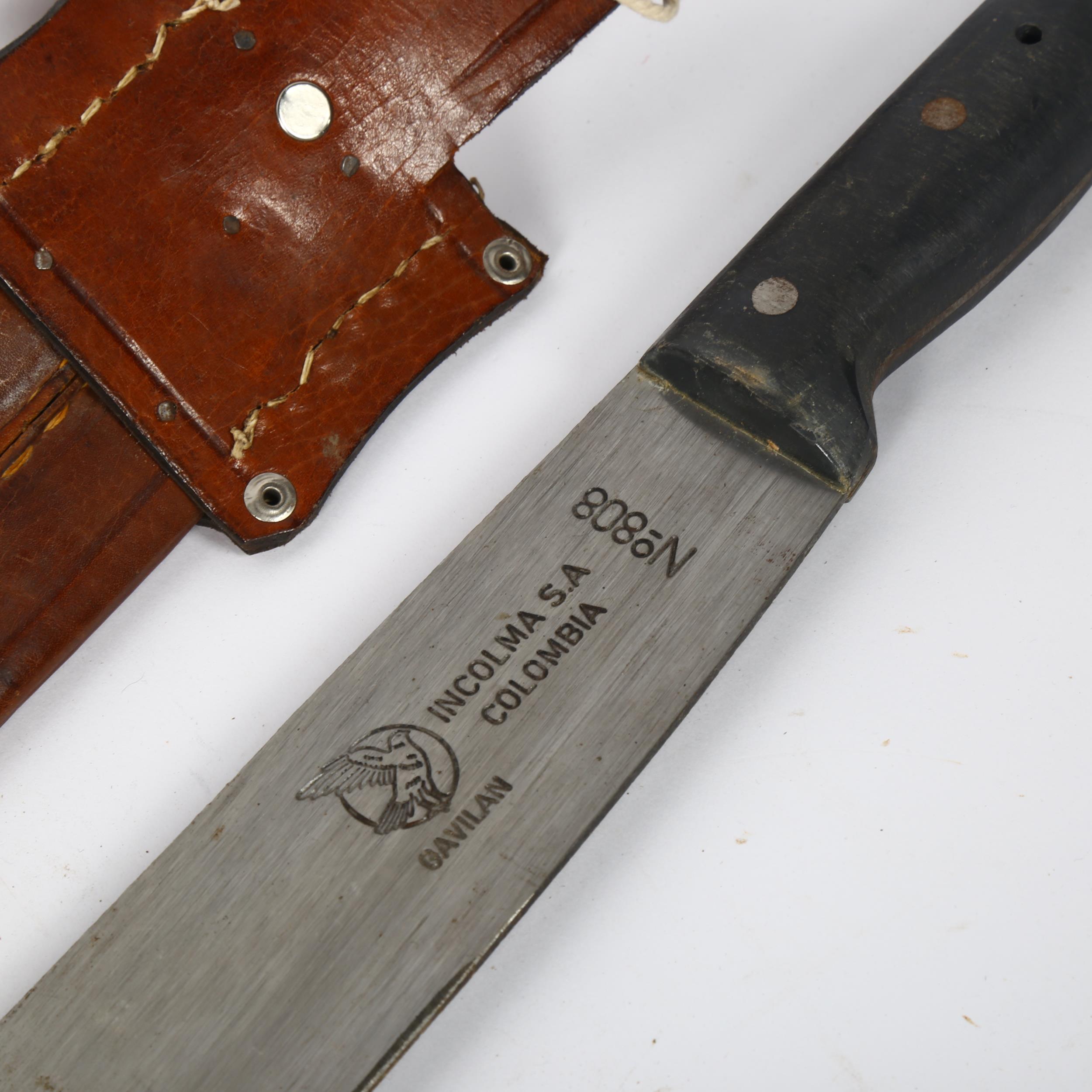 A Honduran machete, circa 1970, with tassel decorated sheath, overall length 74cm, blade length 61cm - Bild 2 aus 2