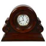 An 8-day mantel clock framed from the central hub of an early aeroplane propeller, on a mahogany