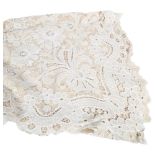 A Brussels lace table cloth, 76cm x 42cm