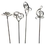 A group of 4 Charles Horner stylised silver-topped hat pins