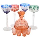 A French 1930s peach glass decanter and 4 shot glasses, 4 overlay Hock glasses, largest height