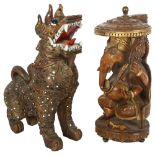 A carved wood figure of Ganesha and a carved wood figure of a foo dog, largest 29cm (2)