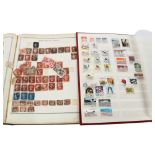 THE IDEAL POSTAGE STAMP ALBUM - containing a Victorian Penny Black, lettered IL, some margins,