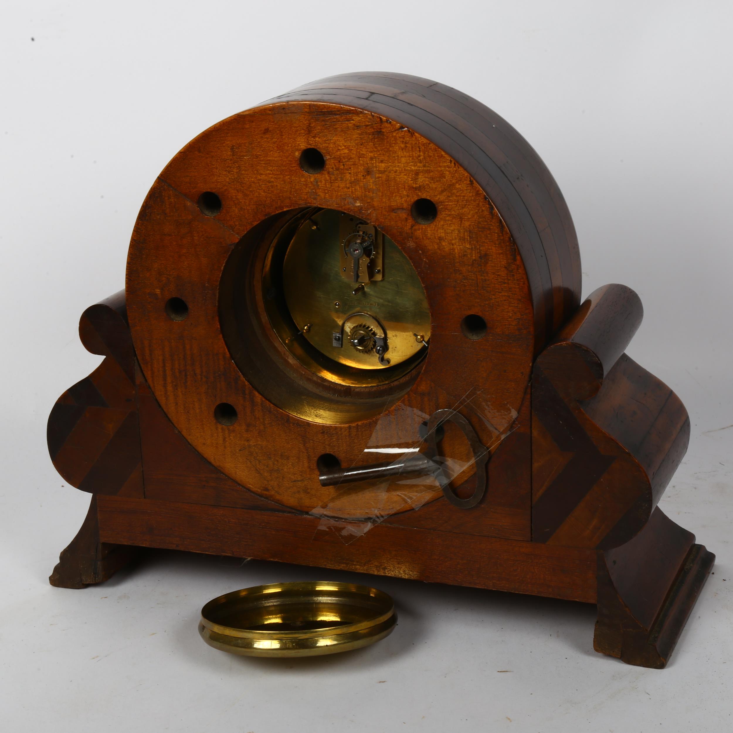 An 8-day mantel clock framed from the central hub of an early aeroplane propeller, on a mahogany - Image 2 of 2