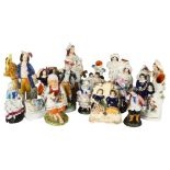 A group of Victorian Staffordshire and Continental figures, and a fairing, tallest 22.5cm