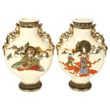 A pair of Japanese cream ground moon flasks, with gilded dragon handles, height 32cm