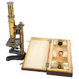 A C Wrichert Wien microscope, Number 3, serial no. 25137, and a wooden box containing various slides