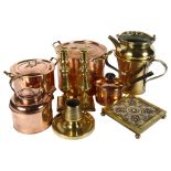 A quantity of brass and copper kitchen utensils, including various boiling pots, teapots, a teapot