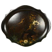 A large Victorian papier mache and lacquered tray of serpentine form, with painted pheasant and