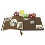 A Vintage family photograph album, and 5 glass paperweights