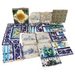 A quantity of Antique and modern ceramic tiles with various designs, including some Delft, largest