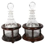 A pair of Victorian Masonic decanters and stoppers, with etched design, 1 marked HAB, the other